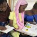 From Capital of Books to an International Book Event: Les 72 Heurs du Livre in Guinea- engl/ger/fre 8 Trois collegiennes plongees dans des romans et livres pour ados lors des 72 heures du livre a Conakry